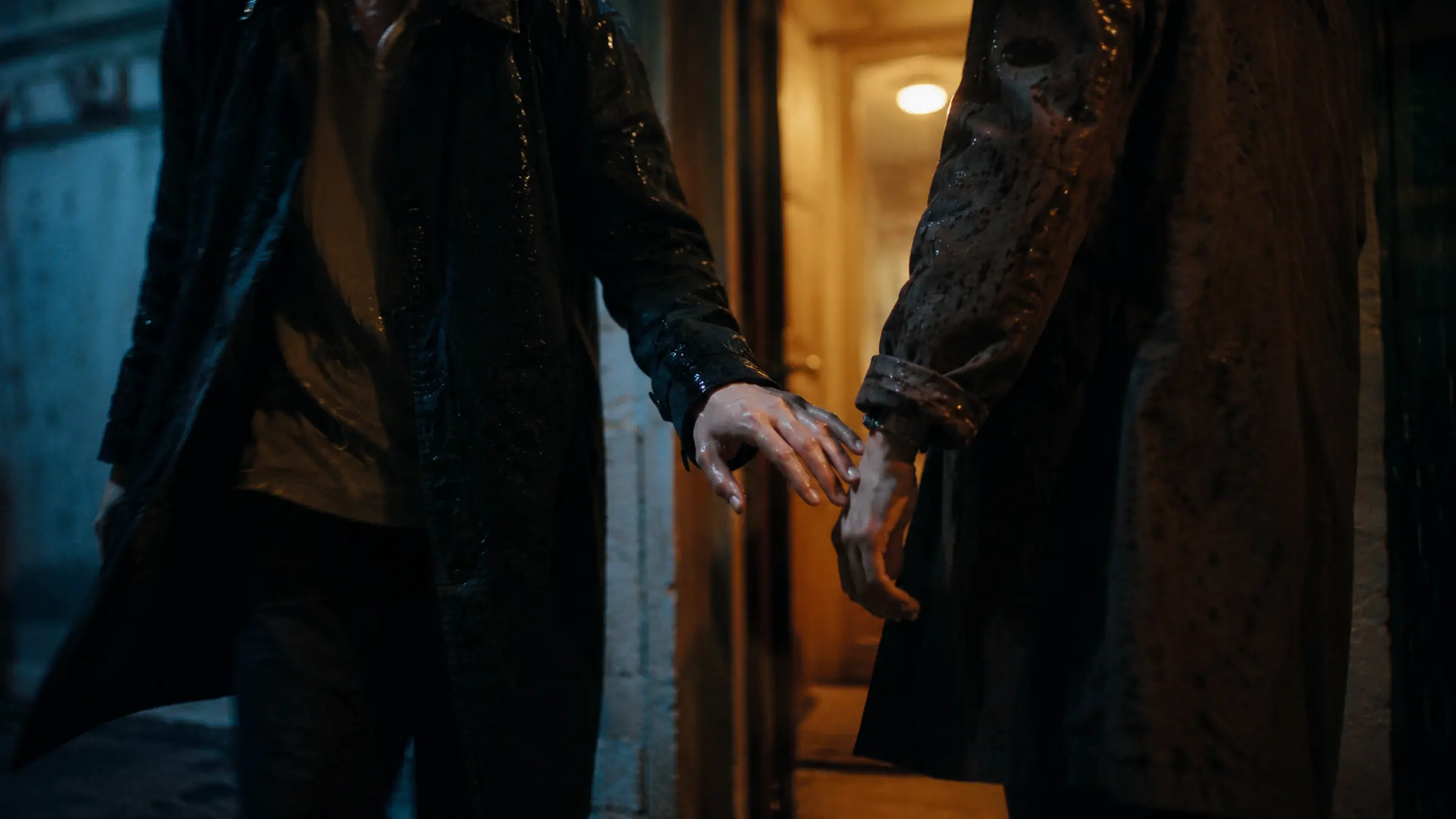 A cinematic hallway moment where two friends pause mid-step, almost touching hands as the friendship turns visibly strange