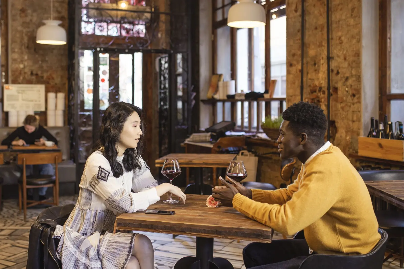 Two people in an early dating conversation checking whether the talking stage is becoming clearer