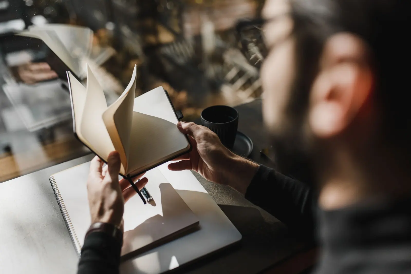 Love Hurts Quotes for Heartbreak, Healing, and Choosing Yourself: a person writing in a journal by soft window light